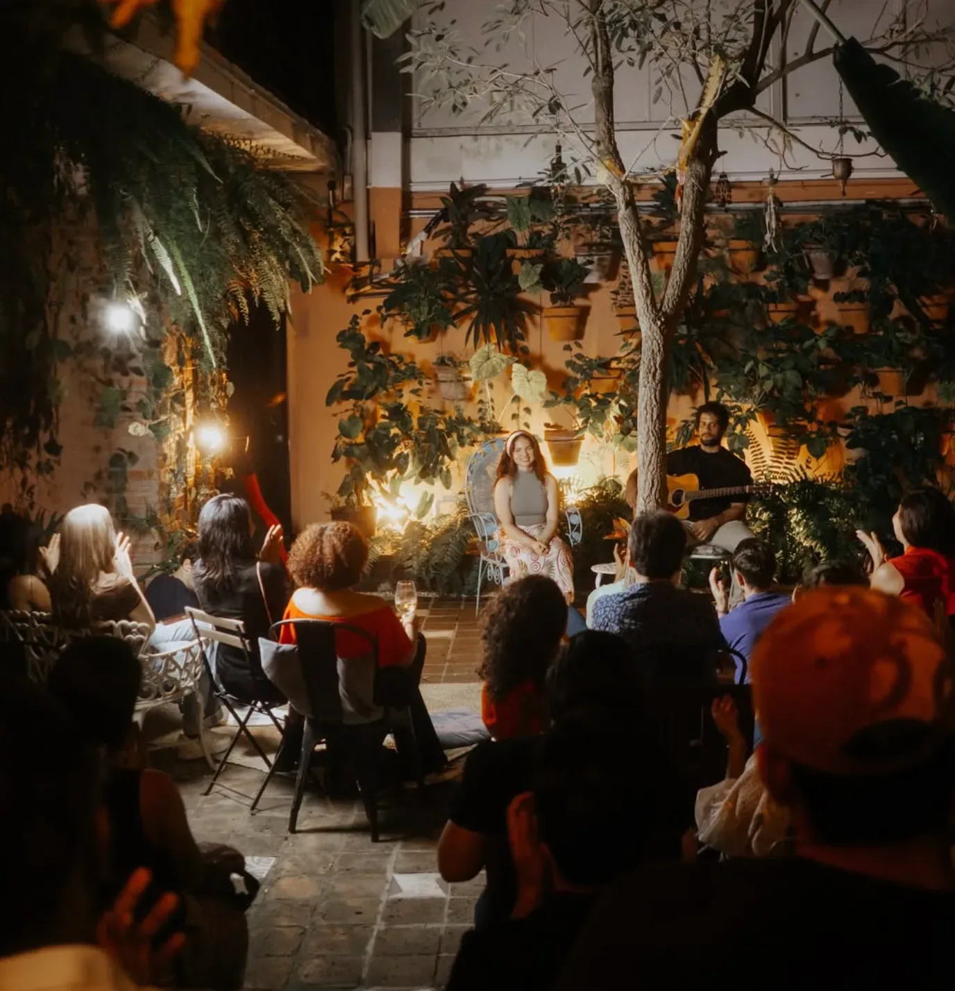 Unplugged open mic performance and audience in Santo Domingo