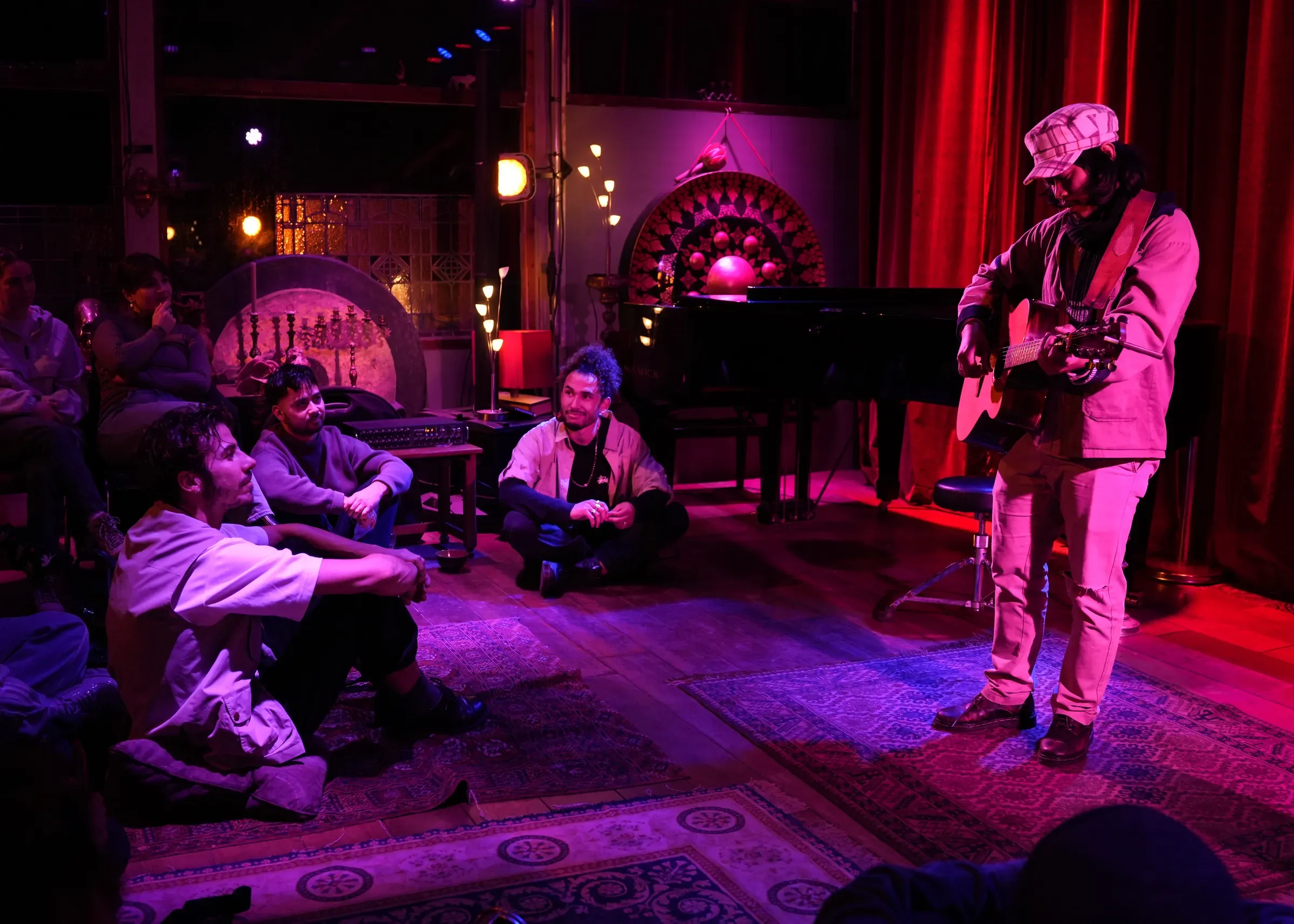 Unplugged open mic performance and audience in Amsterdam